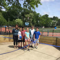 <p>Vanessa Janec and the sixth-grade grant writers cut the ribbon to celebrate the opening of the Gaga Pit.</p>