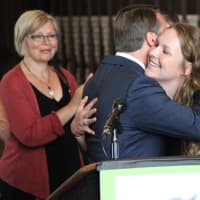 <p>County Executive Rob Astorino hugs Sarah Tubbs after she spoke about her sexual assault on a SUNY college campus. Tubbs receives her master&#x27;s degree in social work Wednesday from Hunter College.</p>