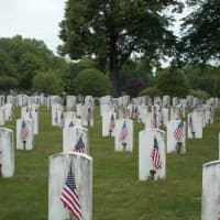 <p>Veterans&#x27; graves decorated with flags.</p>