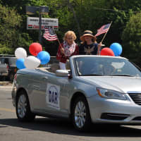 <p>Good Wife&#x27;s Chapter DAR car driven by Regent, Katherine Love with DAR members, Diane Drugge and Elizabeth Hobbs waving.</p>