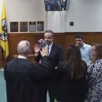 <p>New Tuckahoe Trustee Antonio Leo being sworn into his new office.</p>