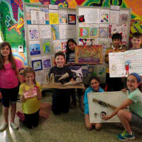 <p>Student-artists proudly displayed their work at an art show at Main Street School. </p>