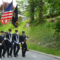 <p>Bedford Hills firefighters march in the hamlet&#x27;s Memorial Day parade.</p>