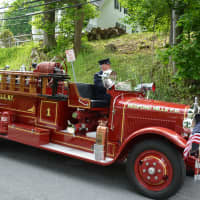 <p>A vintage Bedford Hills firetruck is spotted in the Memorial Day parade.</p>