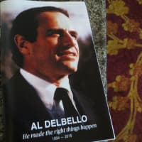 <p>An image of Al DelBello from his earliest years in politics on the cover of a program at Thursday&#x27;s memorial service attended by more than 300 people.</p>