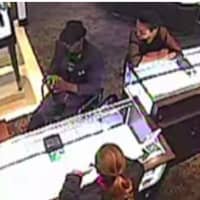 <p>Police say Larry Johnson, pictured in wheelchair at left, jumped up from the wheelchair and ran off with a Rolex watch in a theft from a Stamford Mall jewelry store.</p>