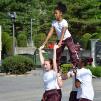 <p>Cheerleaders do a performance at Mount Kisco&#x27;s Memorial Day parade.</p>