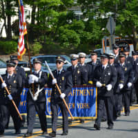 <p>Mount Kisco firefighters march in the Memorial Day parade.</p>
