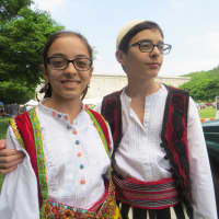 <p>Elisa and Denis Qehaja, sixth grade twins, were among the youths from Our Lady of Shkodra Church in Hartsdale preparing to dance at Kensico Dam Plaza before thunderstorms rolled in on Sunday.</p>