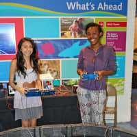 <p>Nazareth Hernandez (left), a sophomore at Norwalk High School, and Daija Brunson, a freshman at Brien McMahon High School, operate remote-operated vehicles they built during the TeMPEST after-school program.</p>