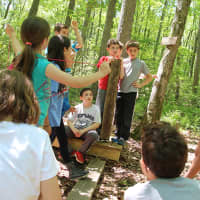 <p>Columbus Elementary School students listen to the challenge on one of the &quot;Islands&quot;</p>