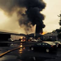 <p>Heavy smoke can be seen rising from the warehouse fire in Fairfield. </p>