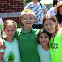 <p>From left, second-graders Anna Von Kennel, Brandt Kiser, Isabella Lonergan and and Katie Ruhe show their &quot;Green Team Power.&quot;</p>