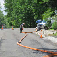 <p>Firefighters were still busy in New Rochelle the day after the fire.</p>