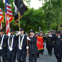 <p>Bedford Hills firefighters march in the Katonah parade.</p>