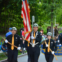 <p>Golden&#x27;s Bridge firefighters march in the Katonah parade.</p>