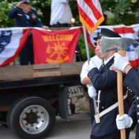 <p>Pleasantville firefighters march in the Katonah parade.</p>