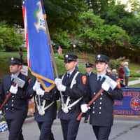 <p>Ridgefield firefighters march in the Katonah parade.</p>