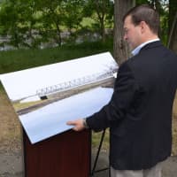 <p>Rep. Stafstrom with the mockup of the future bridge.</p>