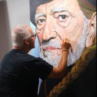 <p>Michael Wagner at work on a Willie Nelson work.</p>