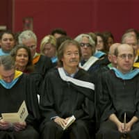 <p>Faculty members watch the commencement ceremony.</p>