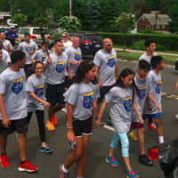 <p>Runners in the Norwalk section of the Law Enforcement Torch Run on Friday morning.</p>