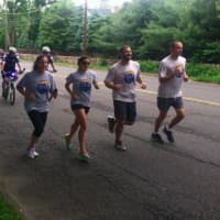 <p>Runners during the Darien section of the Law Enforcement Torch Run Friday morning.</p>
