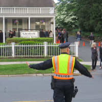 <p>Rye police directing traffic on Friday evening outside the wake for Katherine Chappell, the video effects editor killed on Monday by a South African lion.</p>
