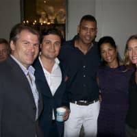 <p>Allan Houston (center) and Kelly Rohrbach (right) with pals at the opening night party.</p>