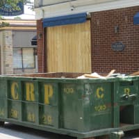 <p>The Eastchester Fish Gourmet was boarded up on Tuesday, as employees continued clearing out debris following the crash.</p>