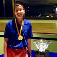 <p>New Rochelle middle school student Jake Gallin with the trophy celebrating his volunteer work.</p>