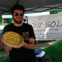 <p>Bobby Goelz, of Du Soleil, holds a quiche at Wednesday&#x27;s Wilton Farmers Market.</p>