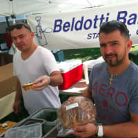 <p>Giovanni Castano, right, owner of Beldotti Bakeries and his brother Fernando, at the market.</p>