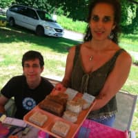 <p>Lisa Sodaro and her son Jacob at their display at the Wilton Farmers Market. Sodaro owns Natural Herbal Creations. </p>