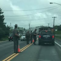 <p>State police question motorists in the area of the Clinton Correctional Facility in Dannemora, N.Y., during their manhunt for two escaped prisoners convicted of murder.</p>