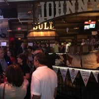 <p>Crowds pack Johnny Utah&#x27;s for the cocktail party and auctions, featuring more than 75 items up for bid.</p>