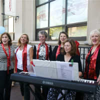 <p>The group The Bows entertained outside Bank Street Events.</p>