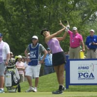 <p>Michelle Wie tees off Thursday at Westchester Country Club.</p>