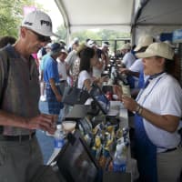 <p>Spectators flocked to refreshment stands on a hot afternoon.</p>