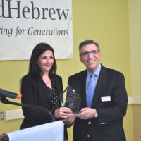 <p>Marissa Brett receives the Community Service Award from Michael R. Rozen, chairman of United Hebrew of New Rochelle. </p>