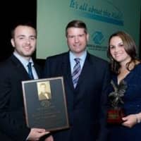 <p>Cameron Rosen, the 2015 Chris Cutri Memorial Award recipient (left) and Jennifer Bonhomme, who accepted the 2015 John Beach Award on behalf of TD Bank (right), stand with BGCNW President R. Todd Rockefeller (center) and display their awards. </p>