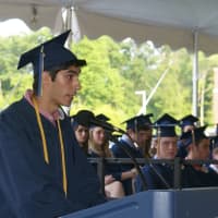 <p>Class Valedictorian Micah Zirn talks to the crowd and the Class of 2015 at Friday&#x27;s ceremony.</p>