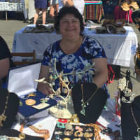 <p>Susan Winters sells her handmade and vintage jewelry from a tent at Georgetown Day.</p>