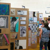 <p>Families browsed the artwork at the exhibit.</p>