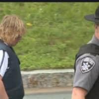 <p>Joyce Mitchell being escorted into court on Monday morning.</p>