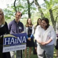 <p>Flanked by New Rochelle Mayor Noam Bramson and other prominent politicians, Haina Just-Michael announced her run for county legislator.</p>