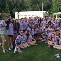 <p>Saxe eighth grade girls Treble Ensemble with their trophy from the Music in the Parks Festival.</p>