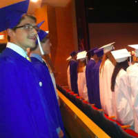 <p>Graduates watch the ceremonies at the Darien High School Tuesday.</p>