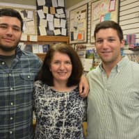 <p>Fine Lines owner Laura Marks (center) with her sons, Alex (left) and David (right).</p>