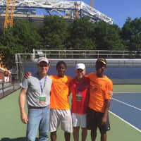 <p>Courage and Hope Crawford, state tennis champions, with their coaches on May 30.</p>